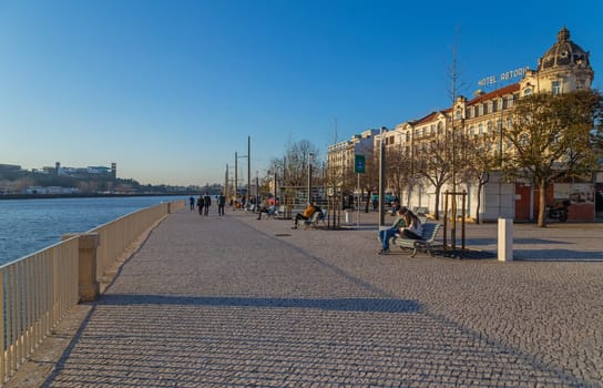Coimbra, Portugal - February 2, 2023: People near the river at Coimbra Old Town, Portugal