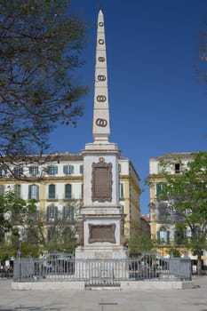 Malaga, Spain, April 2023: View at the obelisk on Plaza de la Merced in Malaga, Spain