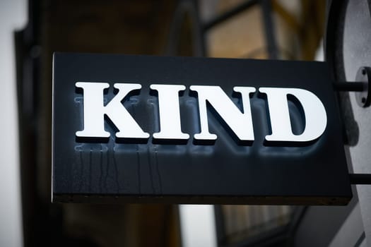 Illuminated sign of the company Kind, specialized store for hearing aids and glasses in the old town of Goslar in Germany