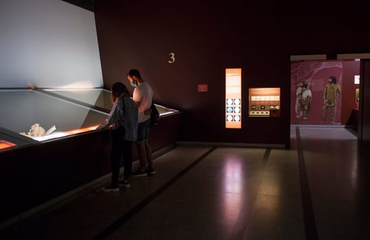 Alcala de Henares, Spain - Oct 10th, 2020: Visitors observing the exhibition at National Archeological Museum of Madrid. Regional Archaeological Museum of Madrid