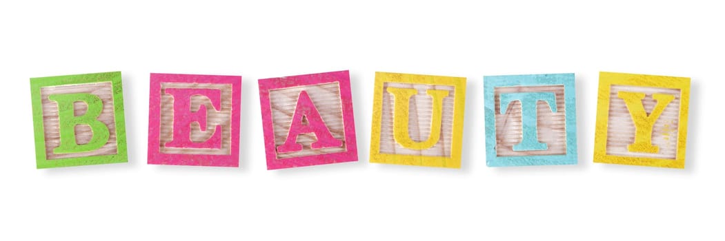 A beauty concept with childs wood blocks on white with clipping path to remove shadow