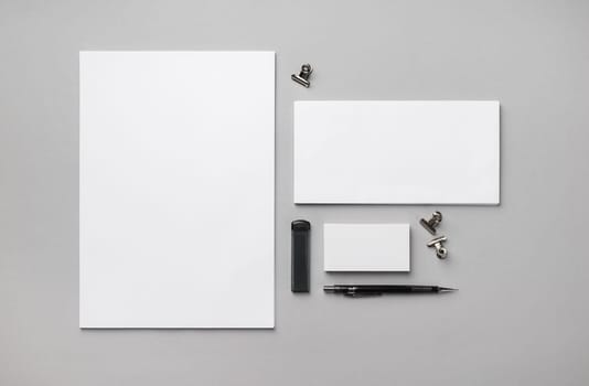 Blank stationery set on gray paper background. Template for branding design. Flat lay.
