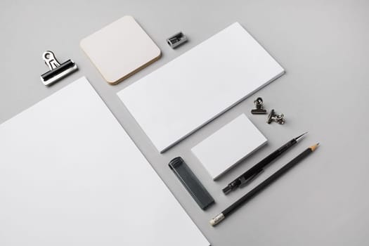 Blank branding stationery set on gray paper background. Responsive design template.
