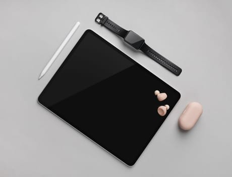 Digital tablet with blank black screen, stylus, smart watch and headphones on gray paper background. Flat lay.