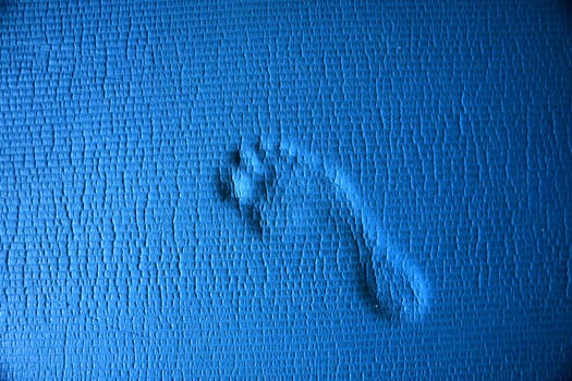 Footprint of a human on a blue underground