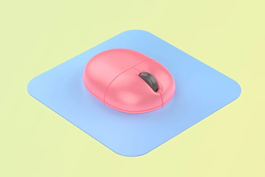 Pink wireless computer mouse with blue mouse pad on green background