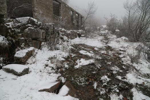 Old house in ruins in the mountains, lots of snow in the north of Portugal