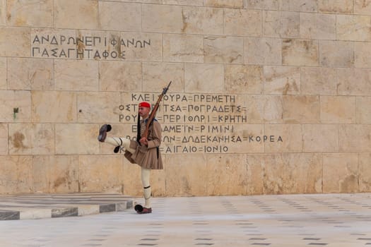 ATHENS, GREECE - MAY 06 2022: Presidential ceremonial guards - Evzones at the Tomb of the Unknown Soldier in front of the Greek Parliament, Athens, Greece