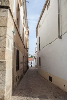 Alcantara streets old town, Caceres, Extremadura, Spain. Pebble stone road pavement