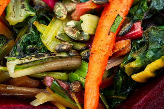 Healthy diet food- stewed chard leaves, beets and carrots. Organic food. Flat lay
