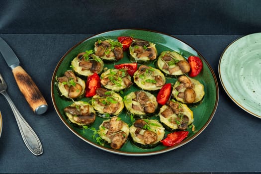 Diet food-baked zucchini with mushrooms. Baked courgette