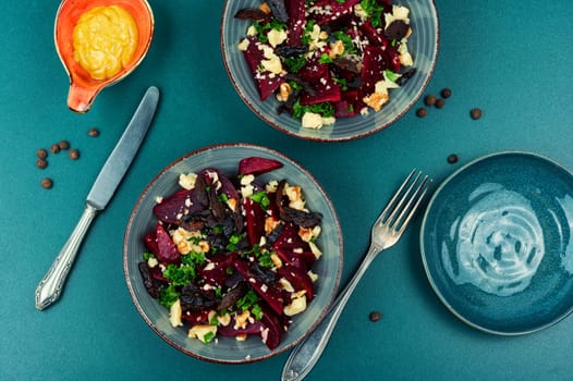 Tasty salad of beetroot, cheese, prunes and nuts