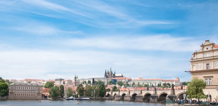 beautiful panorama of karlov bridge and prague castle in a sunny day