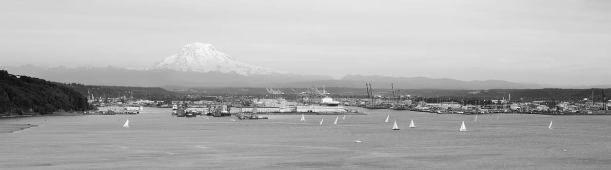 An evening boat race is conducted on the waters of Puget Sound Tacoma Washington