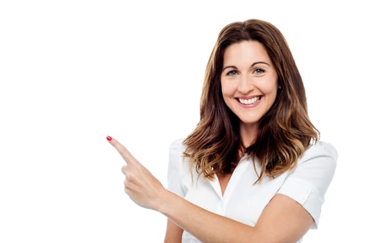 Pretty woman pointing her finger at something
