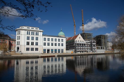 White new building in old style on the old ride in Potsdam