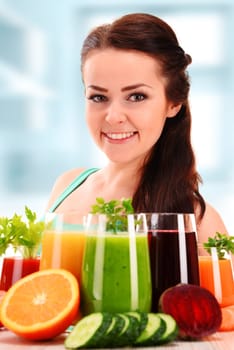 Young woman with variety of vegetable and fruit juices. Detox diet.