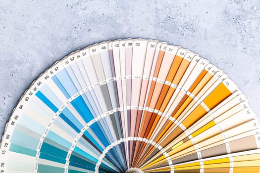 Industrial color palette guide of paint samples catalog on grey background