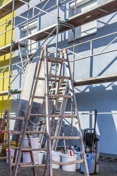 Modern house under construction with scaffold pole platform. New build domestic building