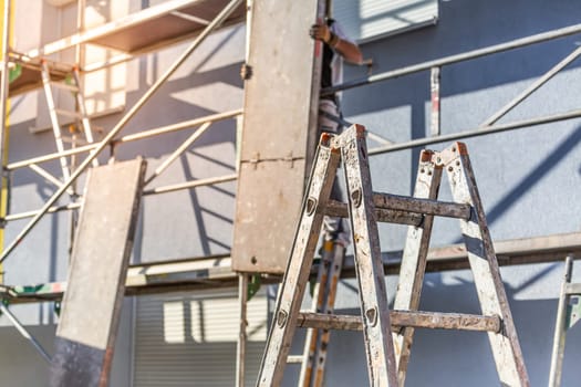 Modern house under construction with scaffold pole platform. New build domestic building