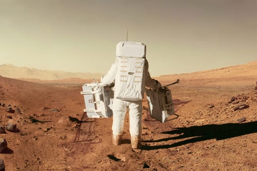 Spaceman astronaut in a space suit with equipment goes through the desert with stones and mountains on the red planet Mars. Colonization new planet, concept. Journey to Mars, creative idea
