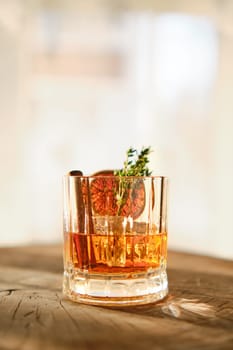 Spicy and sour bourbon and ice sunny cocktail (selective focus photo)