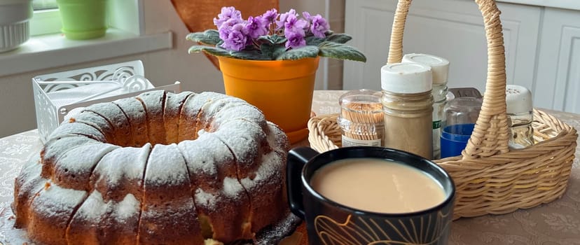 homemade cakes and a cup of coffee with milk on the table