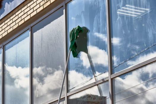 window washing, washing a street shop window. High quality photo