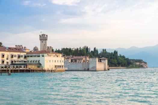 Sirmione, Italy - June 2022: Sirmione castle on Garda lake. Scenic mediaeval building on the water