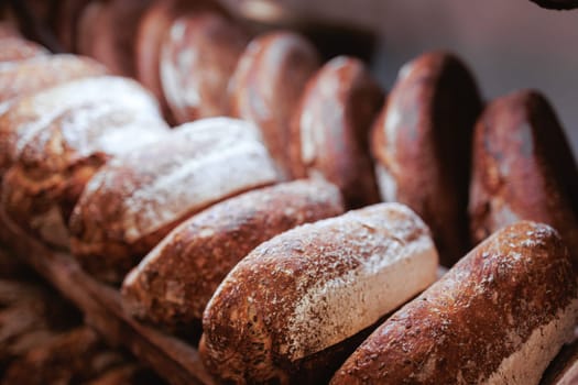 Organic Bakery - details of baker baking bread handmade
