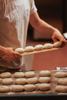 Organic Bakery - details of baker baking bread handmade