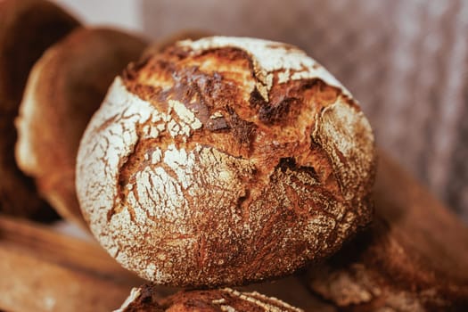 Organic Bakery - details of baker baking bread handmade