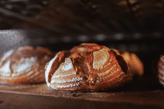 Organic Bakery - details of baker baking bread handmade