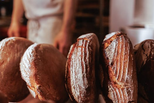 Organic Bakery - details of baker baking bread handmade