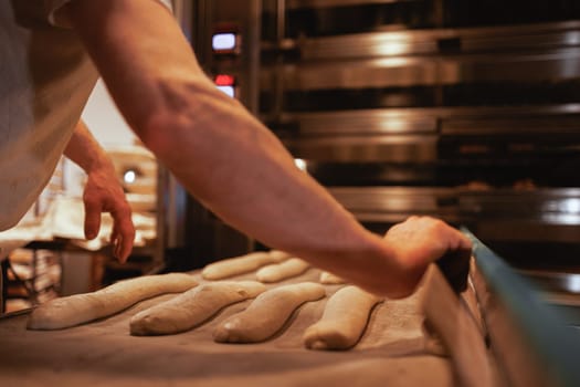 Organic Bakery - details of baker baking bread handmade