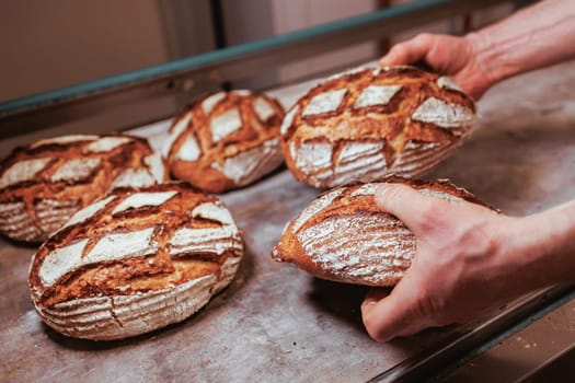 Organic Bakery - details of baker baking bread handmade