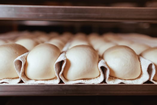 Organic Bakery - details of baker baking bread handmade