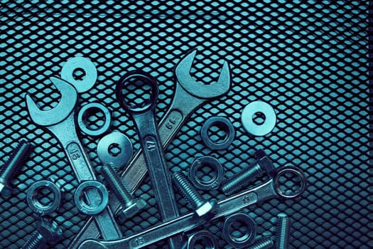 Set of chrome wrenches on steel surface. Mechanic tools for maintenance. Hardware tools to fix. Technical tools background