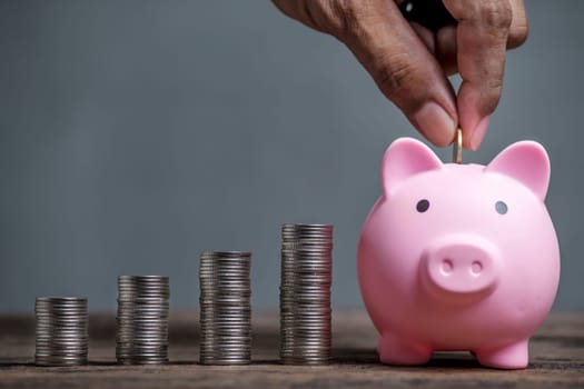 Save money and account banking for finance concept, Piggy bank with coin on blurred background, Save Monney for Investors Using Internet to Trade Stocks or Trade Fund