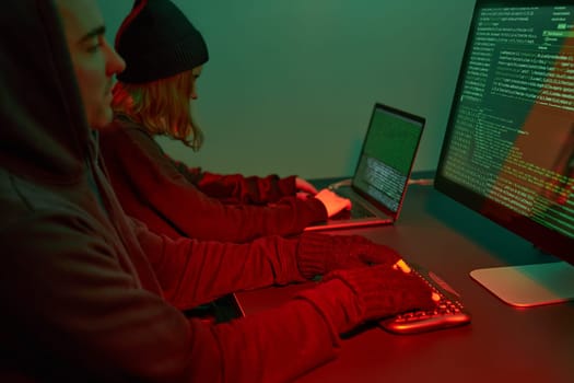 Anonymous people using computer and programming to break code. Cyber security threat. Internet and network security. Access to private information. Anonymous hackers using technology to access to password and encrypted data. Cyber attack