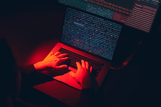 Man using computer and programming  to break code. Cyber security threat. Internet and network security. Stealing private information. Person using technology to steal password and private data. Cyber attack crime