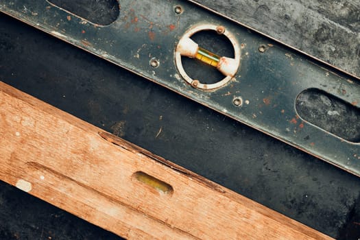 Level tool. Wooden and metal levels close up. Tools on metal surface. Measuring tool. Technical background with copy space