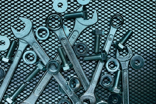 Set of chrome wrenches on steel surface. Mechanic tools for maintenance. Hardware tools to fix. Technical tools background