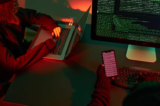 Anonymous people using computer and programming to break code. Cyber security threat. Internet and network security. Access to private information. Anonymous hackers using technology to access to password and encrypted data. Cyber attack