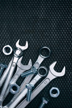 Set of chrome wrenches on steel surface. Mechanic tools for maintenance. Hardware tools to fix. Technical tools background