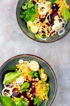 Vegetarian salad with beetroot, lentils, onions and herbs. Low calorie salad.