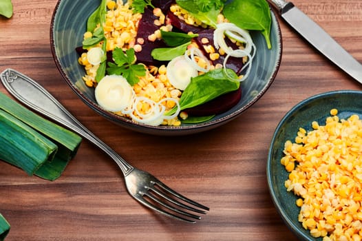 Vegetarian salad with beetroot, lentils, onions and herbs. Low calorie salad.