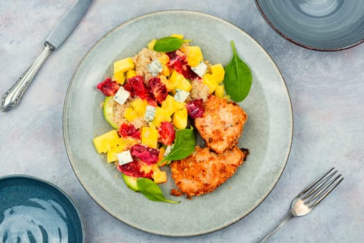Salad with fruit, chicken breast,cheese and quinoa. Healthy food