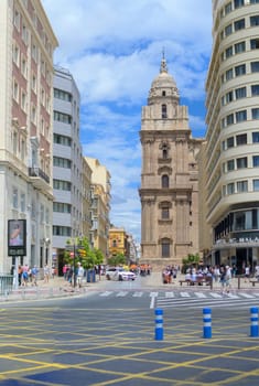 Malaga, Spain, April 2023: View on Molina Lario street with Cathedral of Malaga in the background