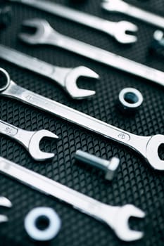 Set of chrome wrenches on steel surface. Mechanic tools for maintenance. Hardware tools to fix. Technical tools background